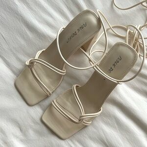 Cream lace up block heels